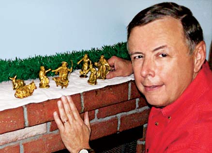Steve Garrington poses with the treasured Nativity set he shares with his wife.