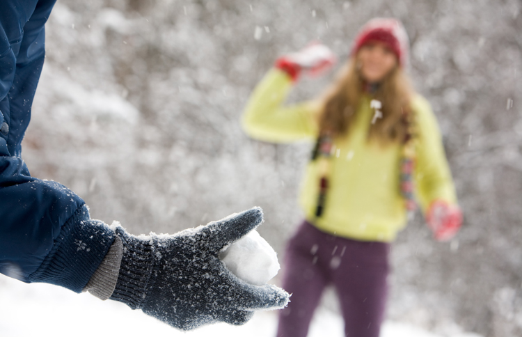 Guideposts: Two young people enjoy a friendly snowball fight