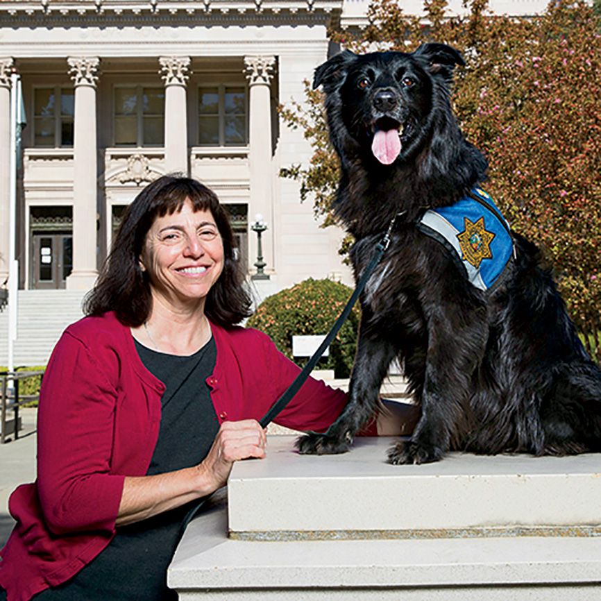 Lori Raineri and her dog, Daisy; photo by Fred Greaves