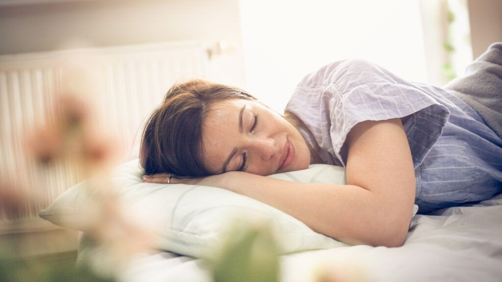 Sleeping woman dreaming (Getty Images)