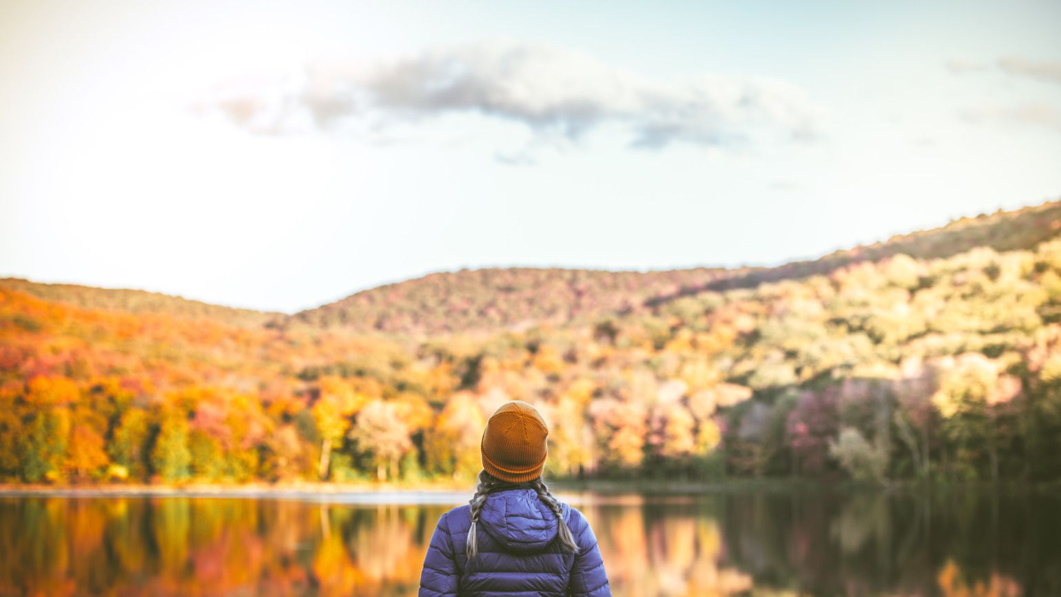 Young Woman in Autumn Landscape (Getty)