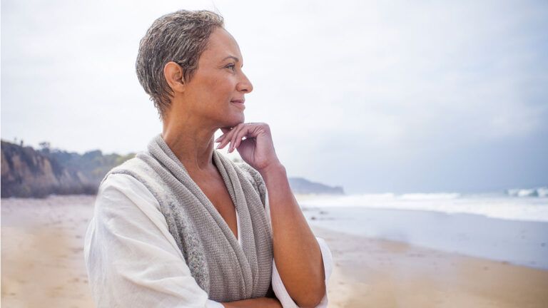 A contented, calm woman at the beach