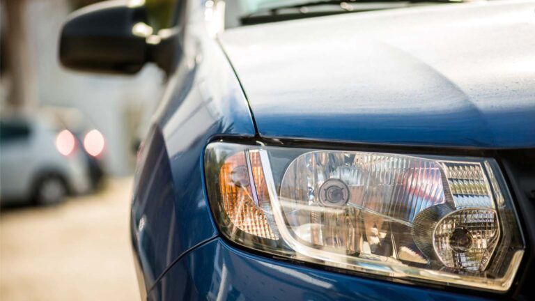 Close up of a parked, blue car; Getty Images