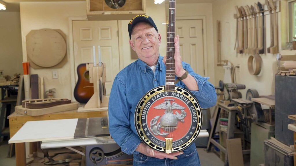 Don Embry with his banjo sharing his god encounter and story of faith